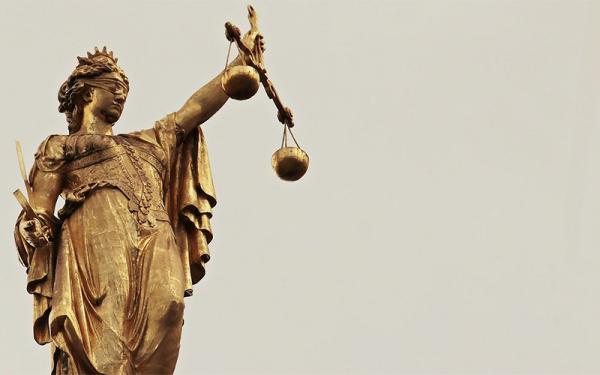 Statue of Goddess Justice holding scales